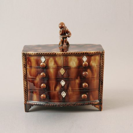 Bank in the form of a Hepplewhite Bow Front Chest