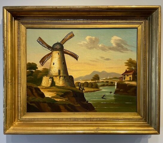 Landscape View of a Windmill Beside a Waterway