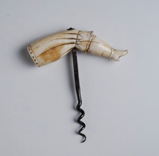 Whale Tooth corkscrew elegantly carved into a Lady's Leg wearing a Bloomer and a