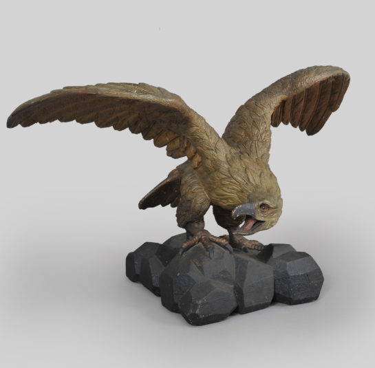 Carved Eagle with Outstretched Wings Perched on Rocks